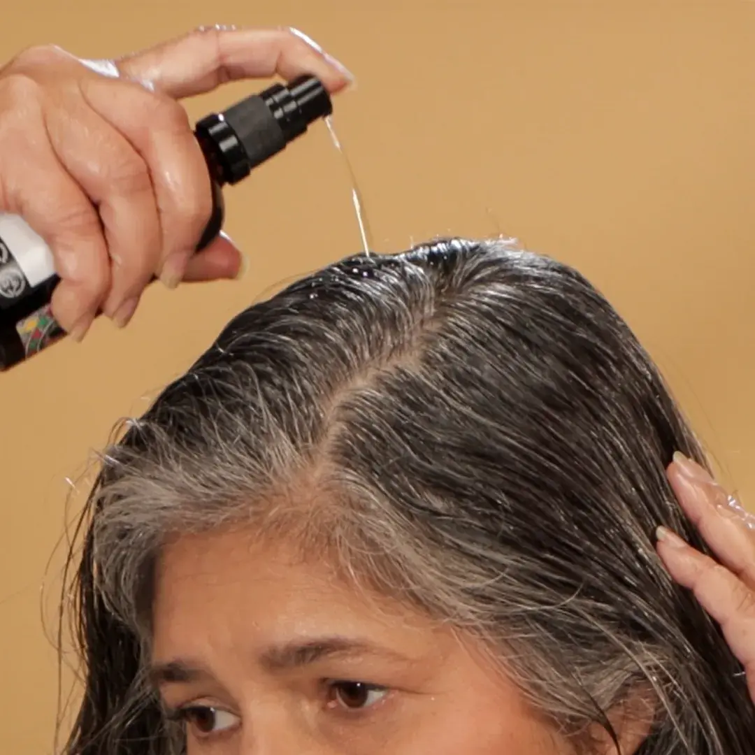 4 pumps of Keranya, distributed across different areas of your scalp.