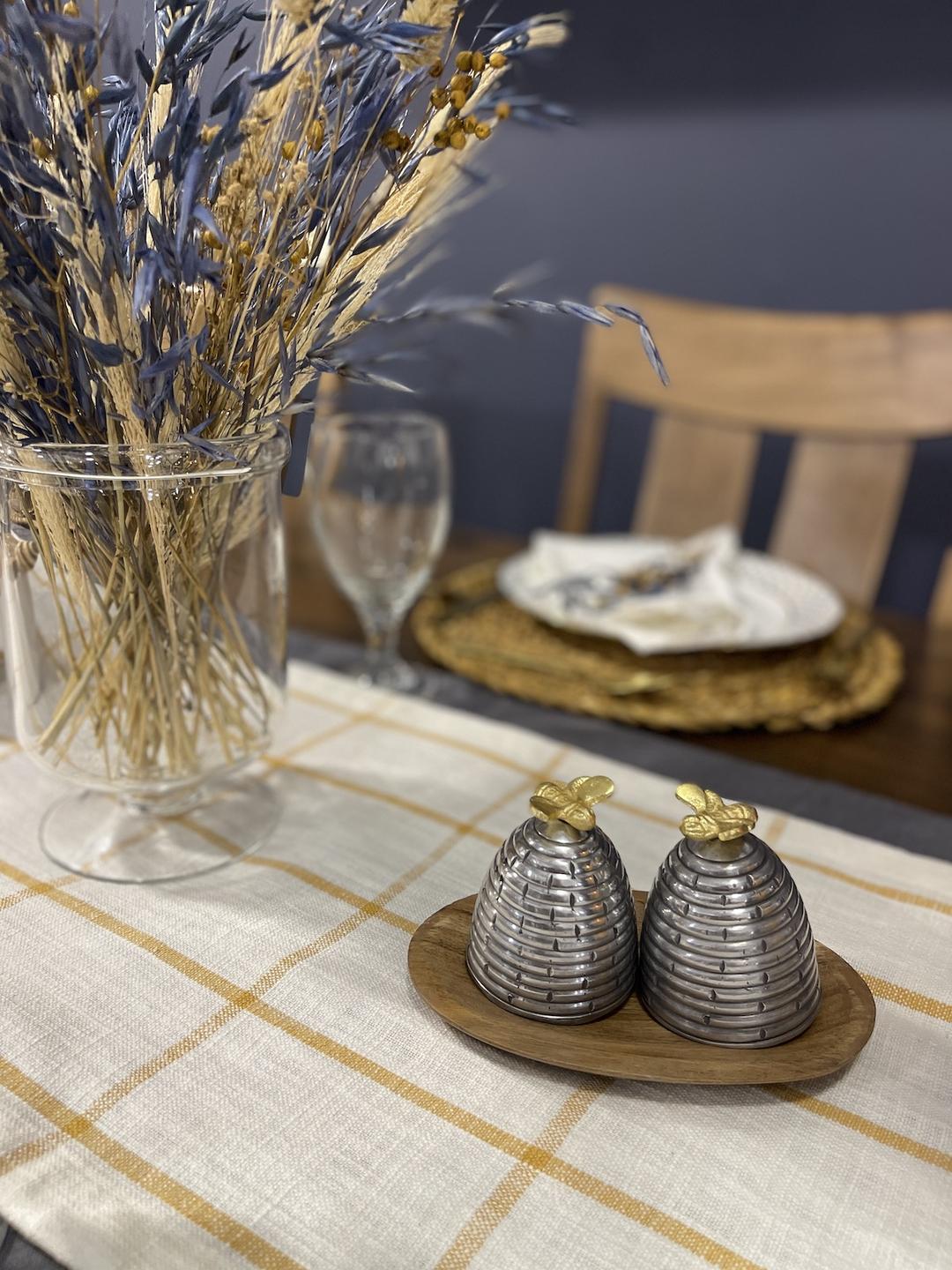 beehive salt and pepper shakers enhance the bee themed table