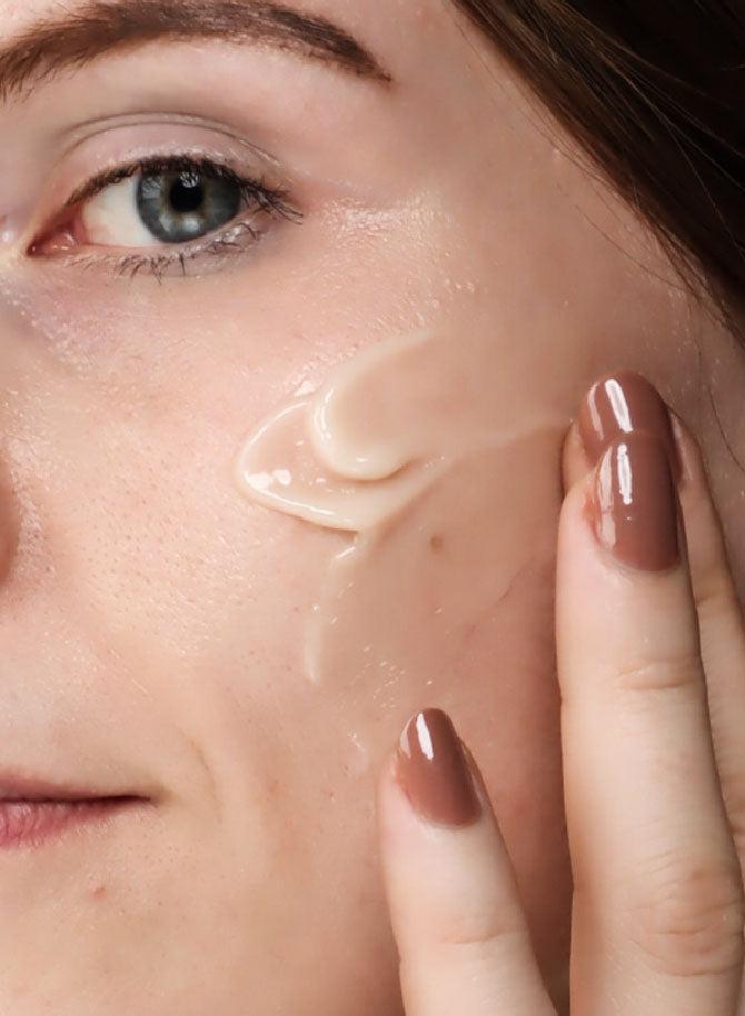 woman applying Smooth-Sorbet Oil-Free Face Gel Crème on face 2