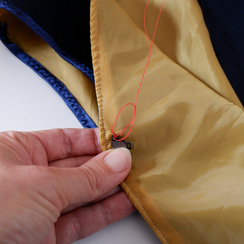 Picture showing a small stitch in the top hook with a knot
