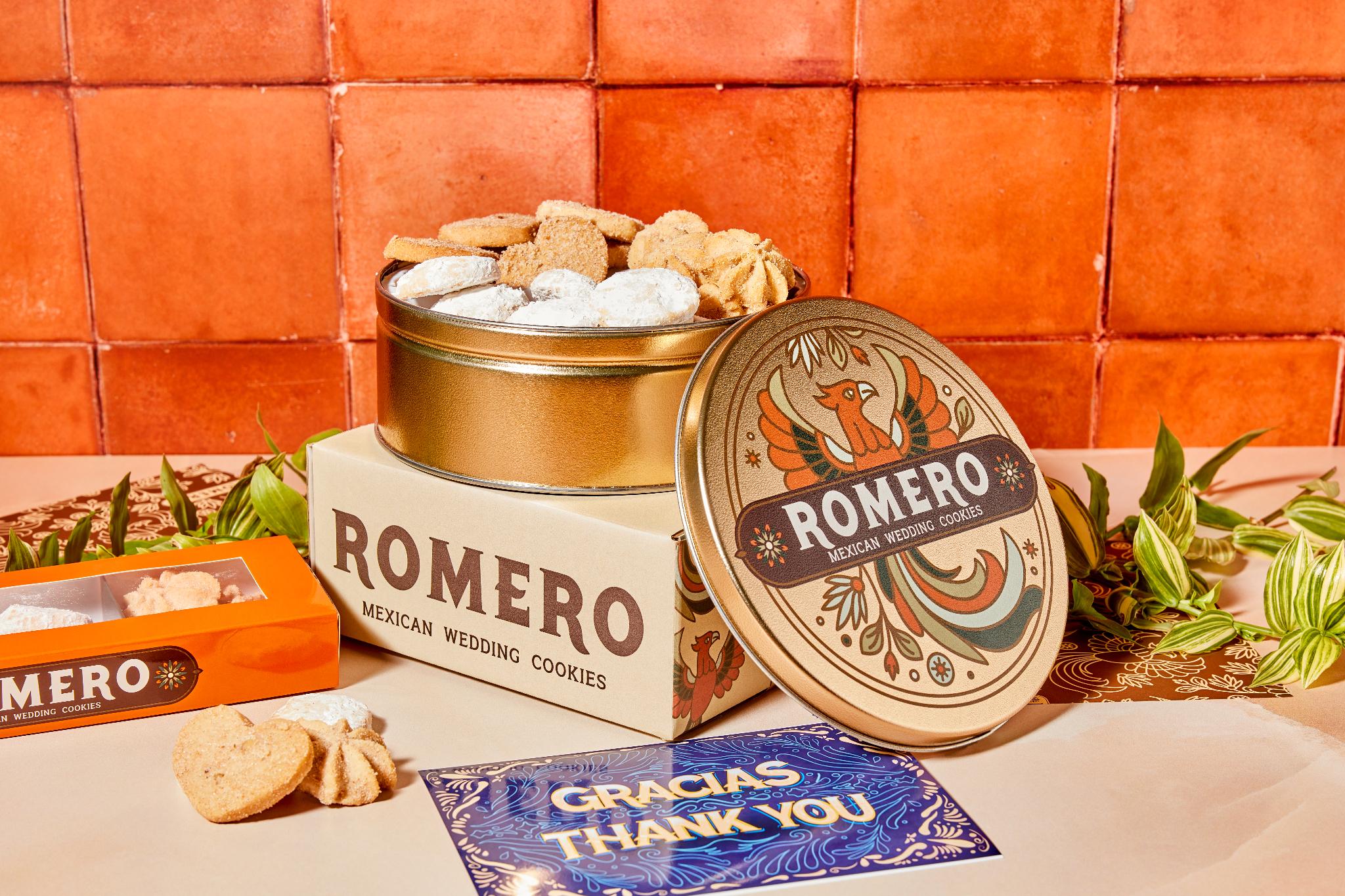 open tin of cookies with thank you card