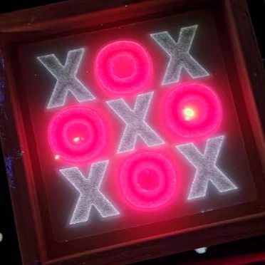 white and red glow in the dark tic tac toe board