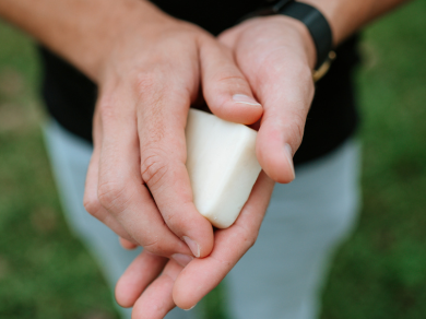 woman holding beesilk lotion bar