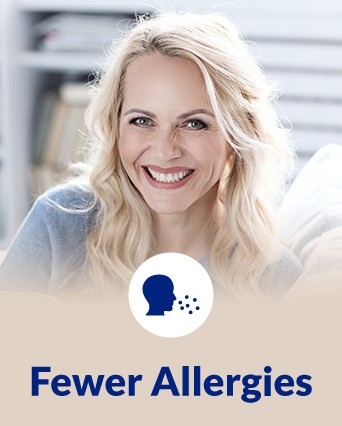 Smiling person with text 'Fewer Allergies' and allergy icon in the foreground.