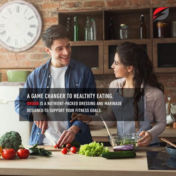 Strength Genesis Origin Keto Salad Dressing & Marinade Ad Two People Making Salad Together in Kitchen