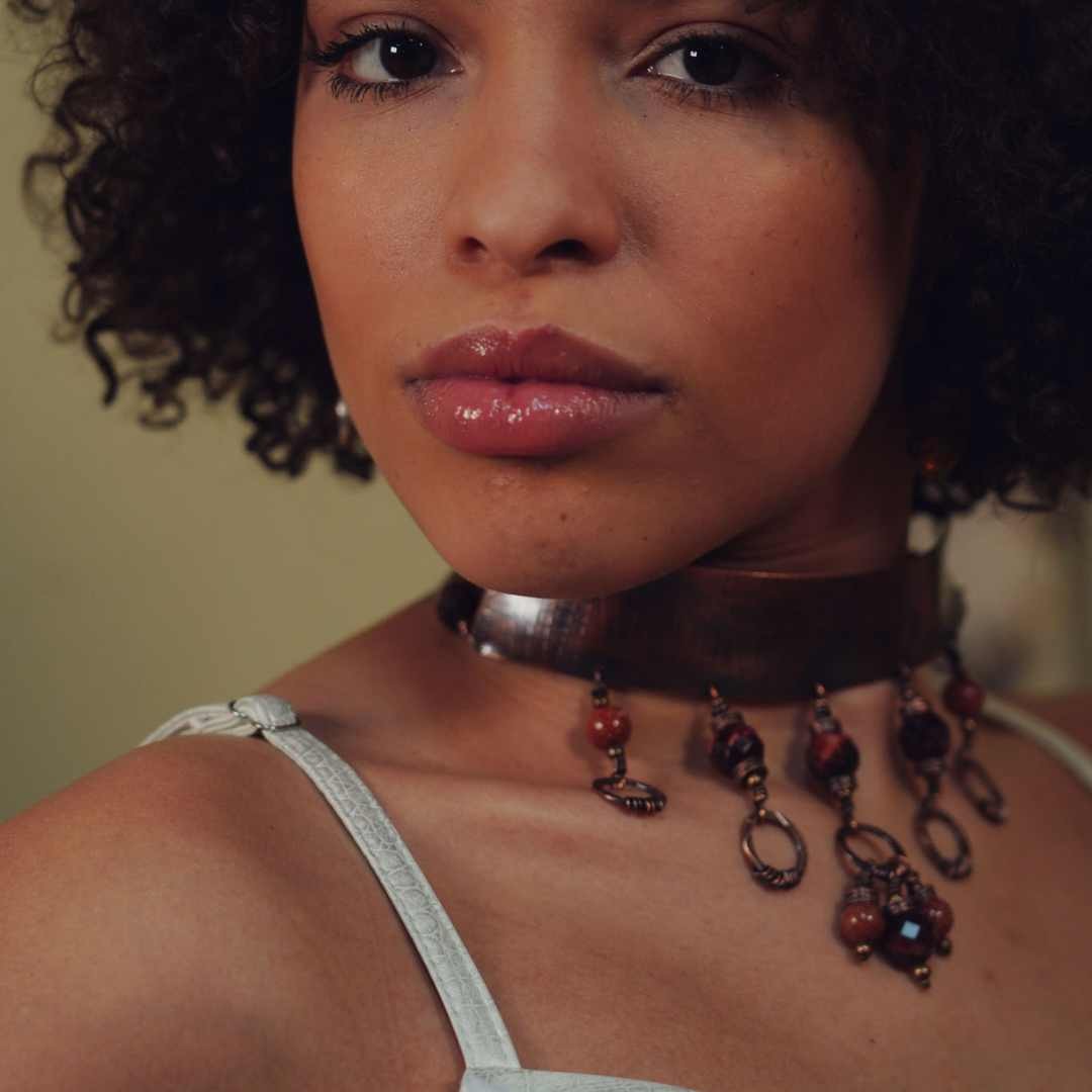 A model wearing the Funky Etched Copper and Tiger's Eye Choker Necklace from Junebug Jewelry Designs