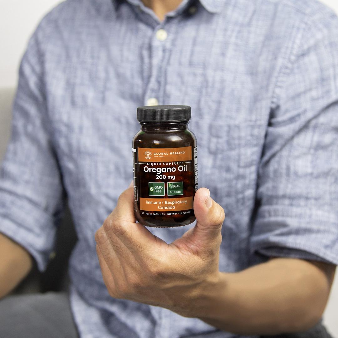 Global Healing Oregano Oil Capsules 200mg Bottle In Hand