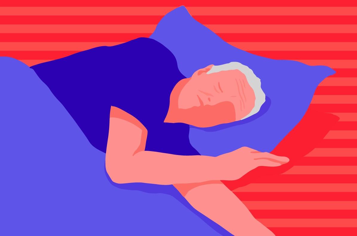 An older adult lying in bed having difficulty sleeping.