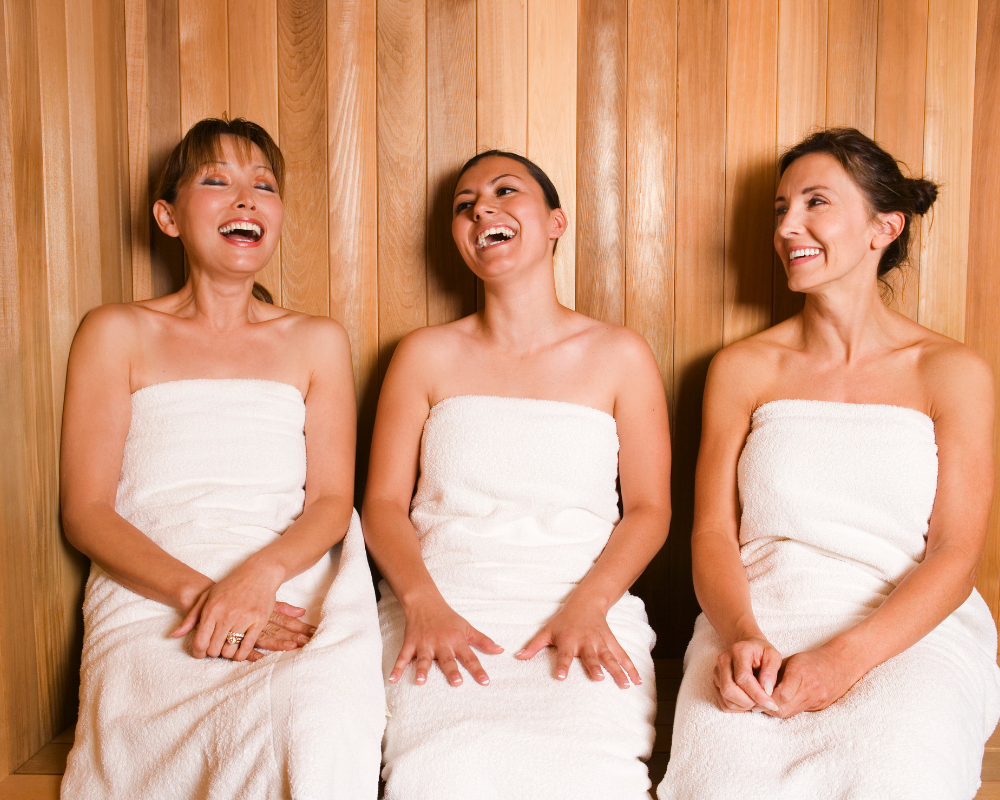 3 woman inside a sauna