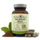 bottle of herbal roots valerian root with valerian capsules on the right of the bottle and valerian root powder on the left.