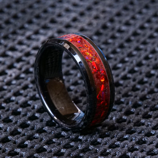 The Crimson Flare Glowstone Ring is a black ring handmade on a black ceramic band and has a striking red inlay