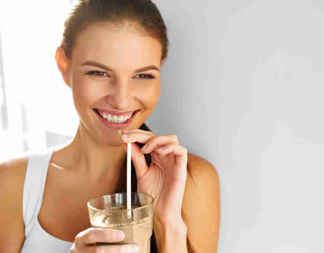 Woman sipping a chocolate shake