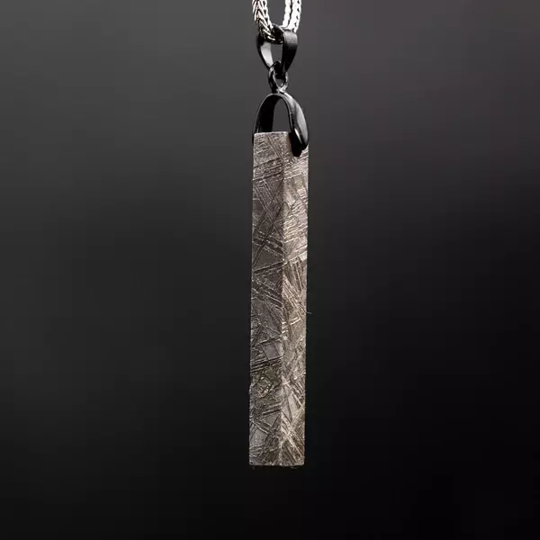The Meteorite Bar Pendant is a meteorite pendant that is crafted with real meteorite