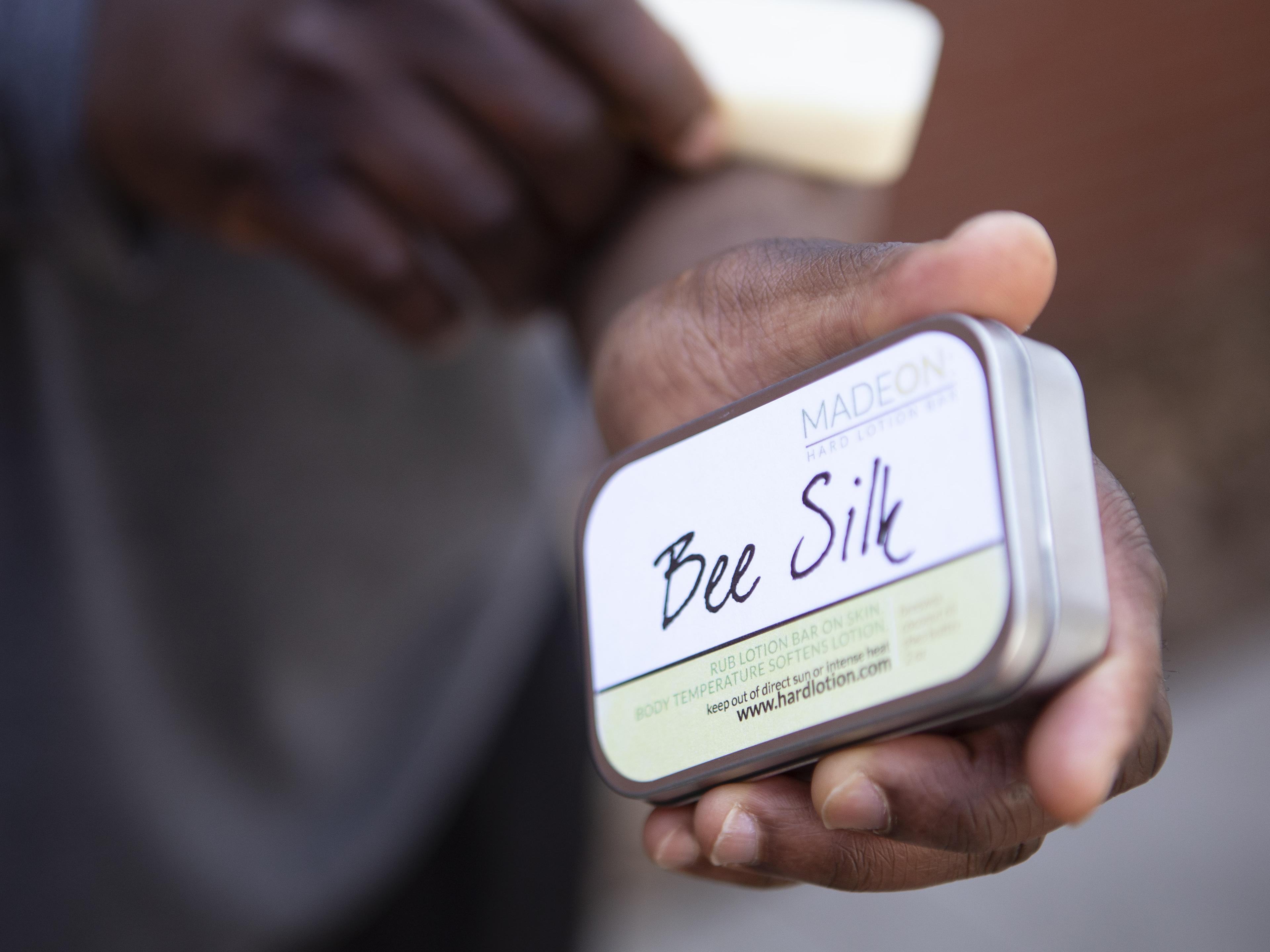 woman holding beesilk lotion bars