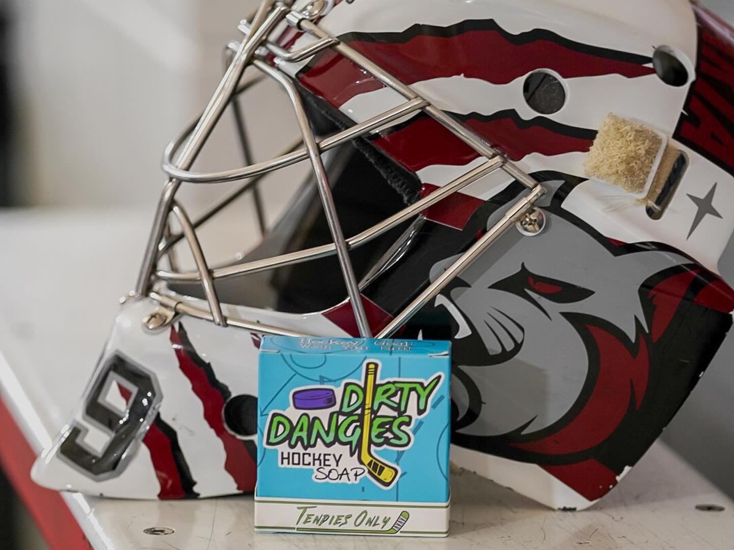 tendies only green jasmine lime hockey goalie soap on a bench with a red and white goalie helmet
