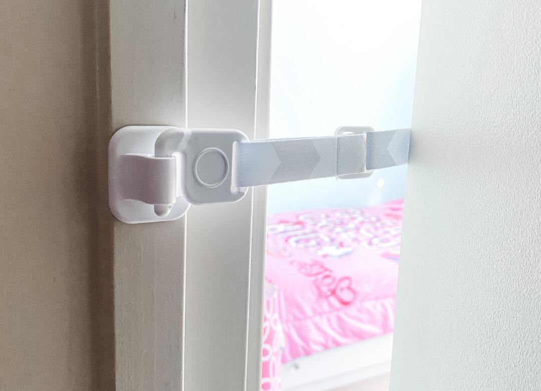 Door Buddy door strap installed on the back of the door and inside edge of the door frame for a strong, tamper-resistant installation.