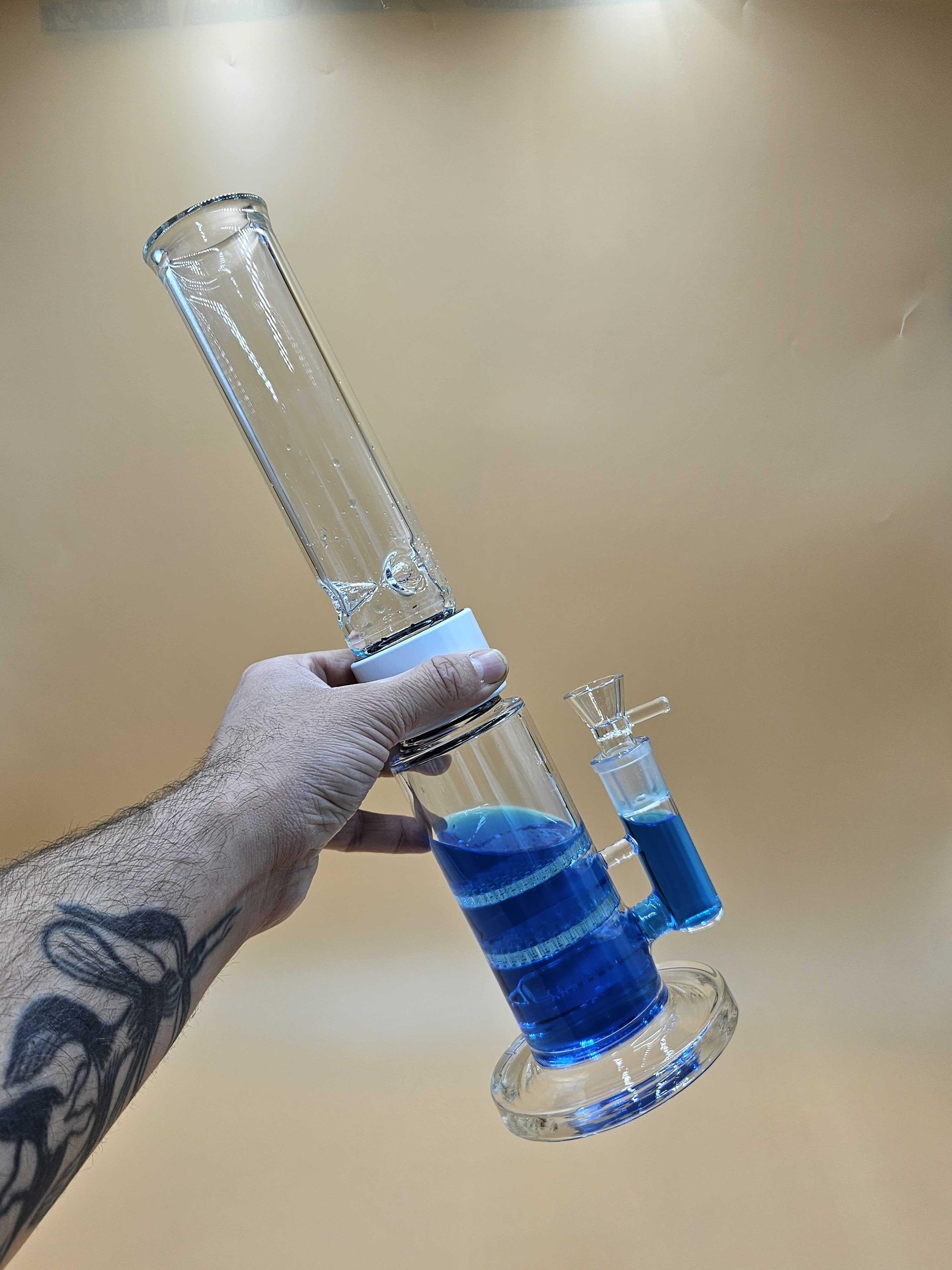 Prism Single Stack Standard Honeycomb modular water pipe filled with bright blue water, illustrating the rising water level and potential splashback issues caused by ice melting during extended use.
