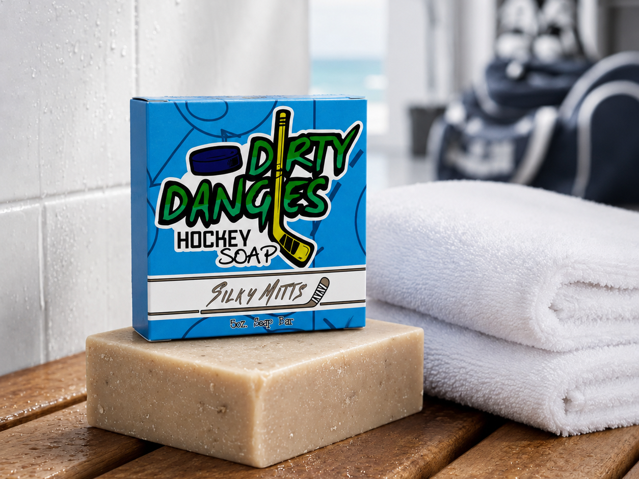 a brown silky mitts oatmeal milk and honey hockey soap bar in a locker room with a clean towel and hockey gear