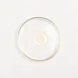 A drop of Keranya Pure Black Seed Potent Hair Potion in a petri dish