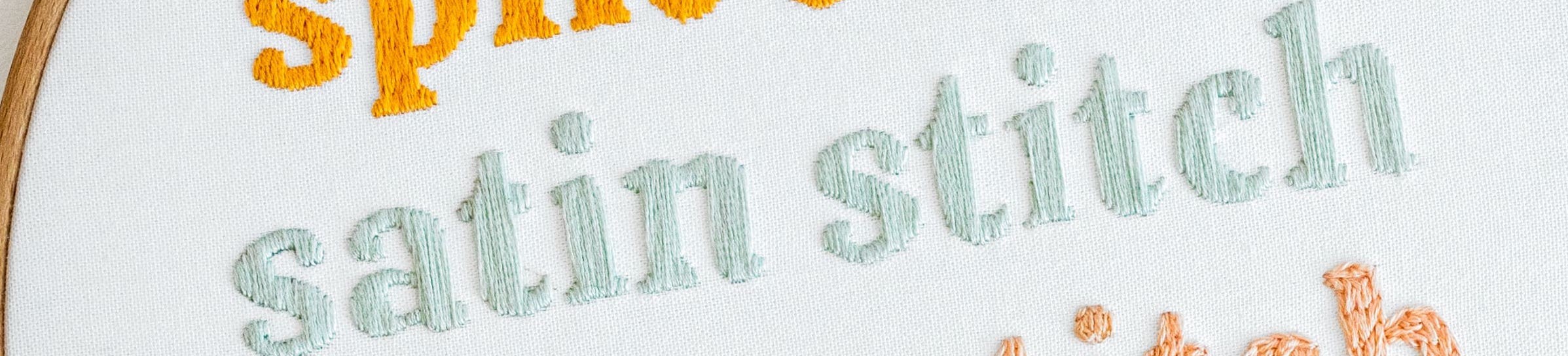 This image is of a word using satin stitch.