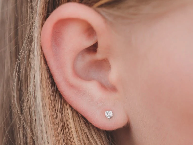 Ear with small heart shaped gemstone stud