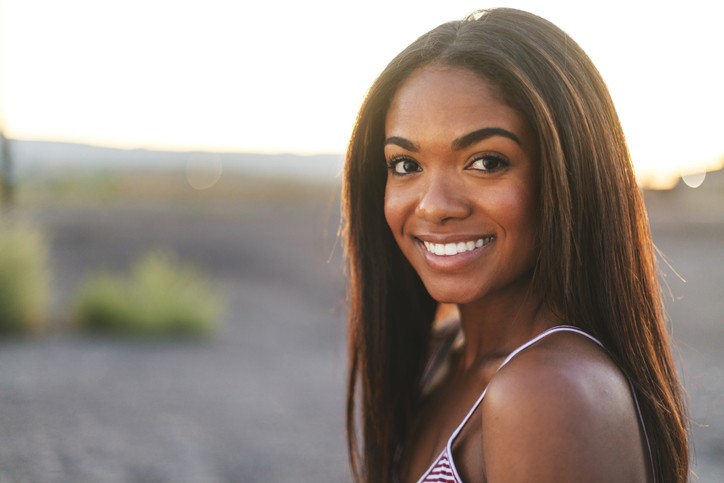 Black woman with healthy hair smiling