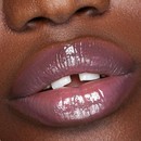 Deep skin tone model lips with Berry Pout