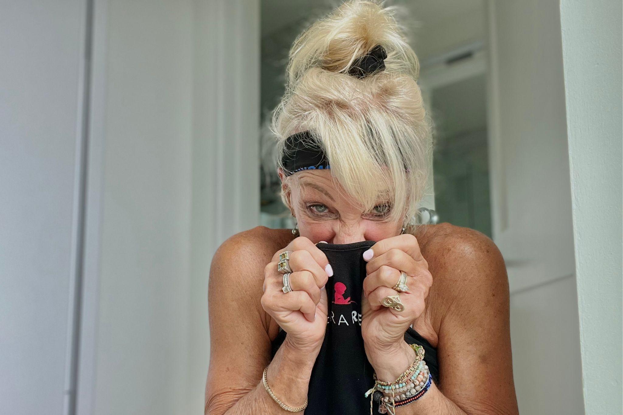 Woman reacting to an old smell, illustrating the discomfort caused by nonenal body odor.