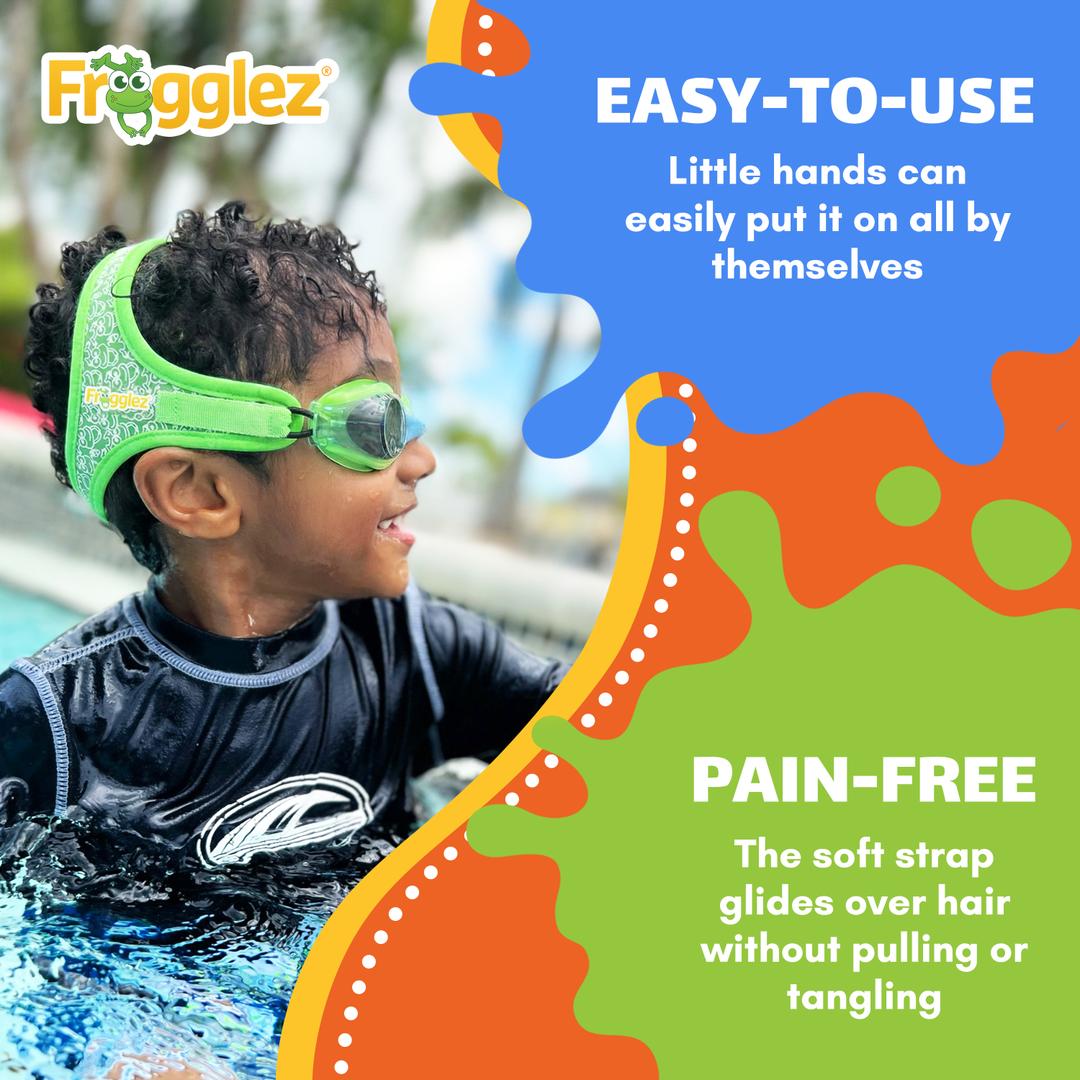 Smiling girl wearing Frogglez Goggles and pink swim cap with a Sensory Friendly certifiication