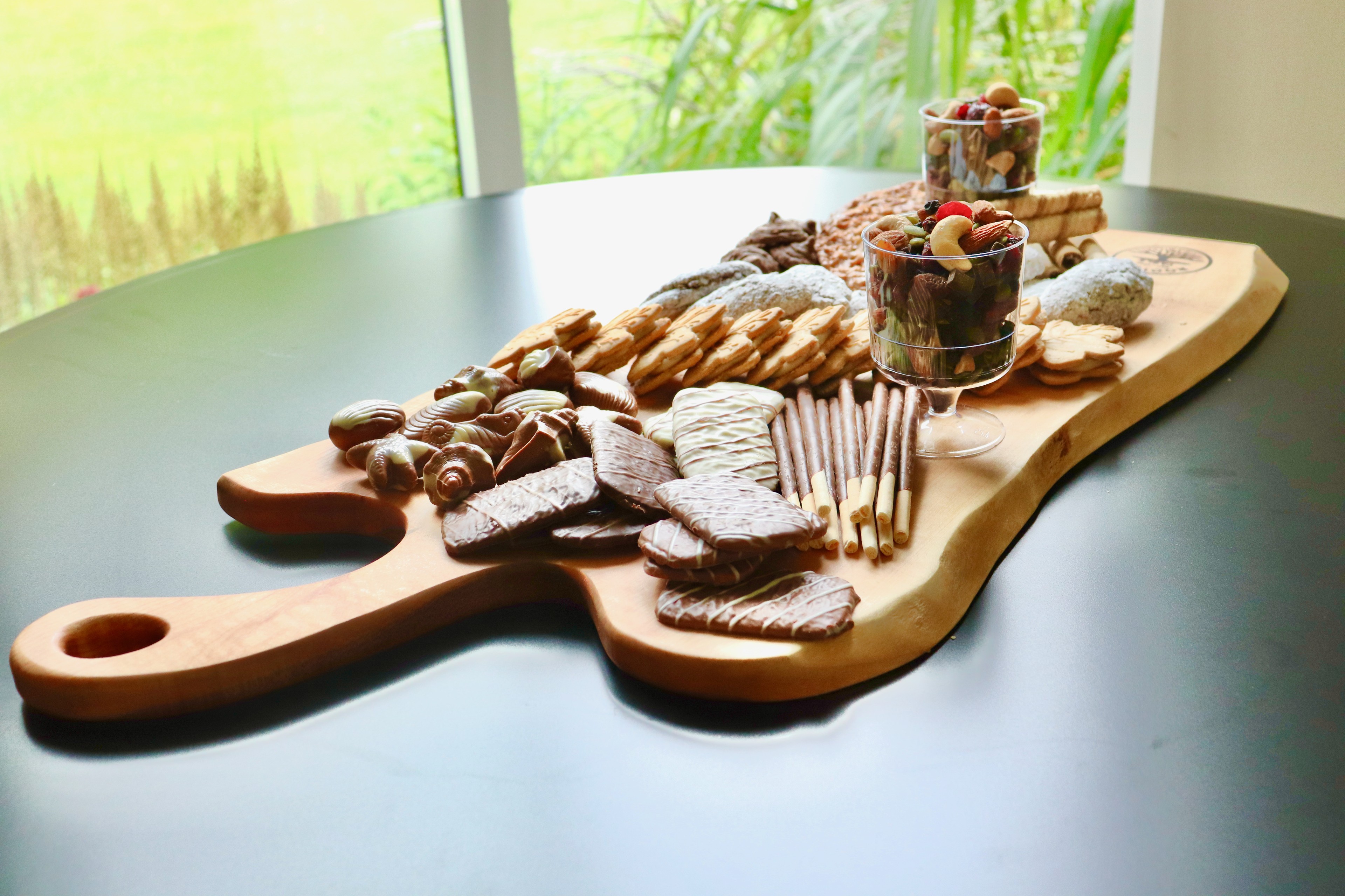 Canopy live edge charcuterie board with scrumptious dessert toppings