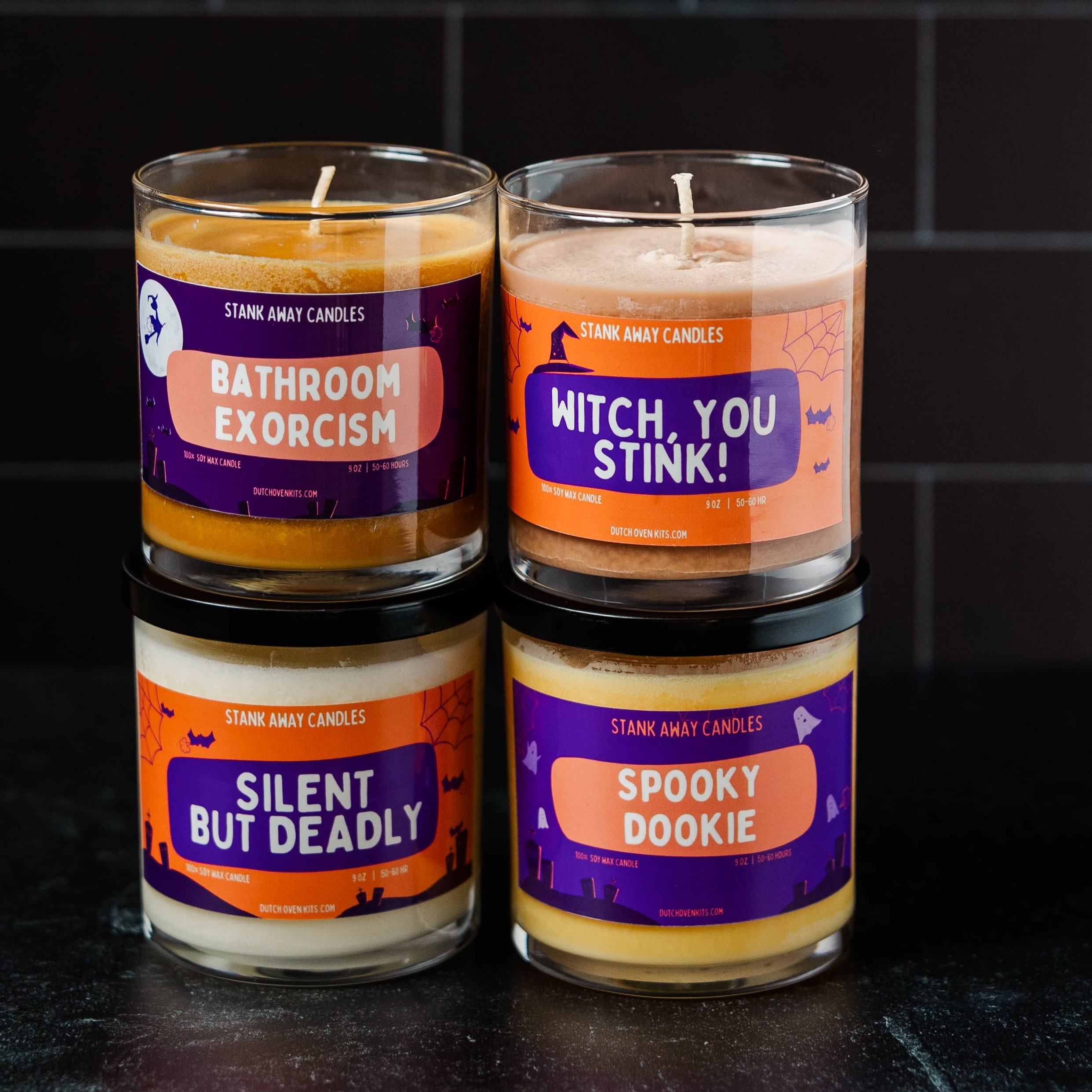 4 halloween candles on a black background. Bathroom Exorcism. Witch, You Stink, Silent But Deadly, Spooky Dookie