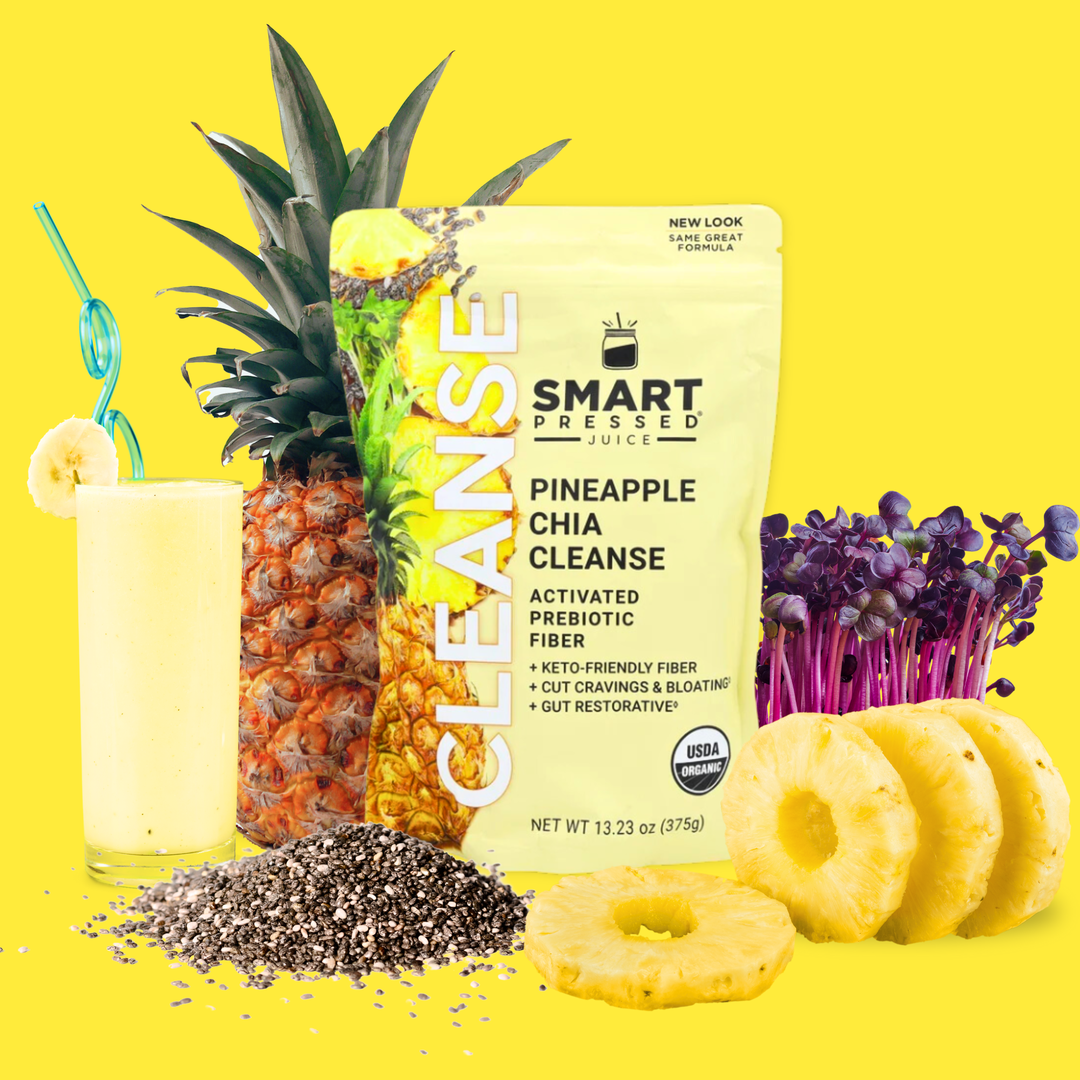 One gusset bag of Pineapple Chia Cleanse on a yellow background. A handful of chia seeds on the bottom left. Next is a tall glass of yellow smoothie with a banana wedge and a blue twisty straw. Beside it is a whole pineapple fruit. On the right side of the gusset bag is a bunch of purple sprouts and 4 round slices of pineapple.