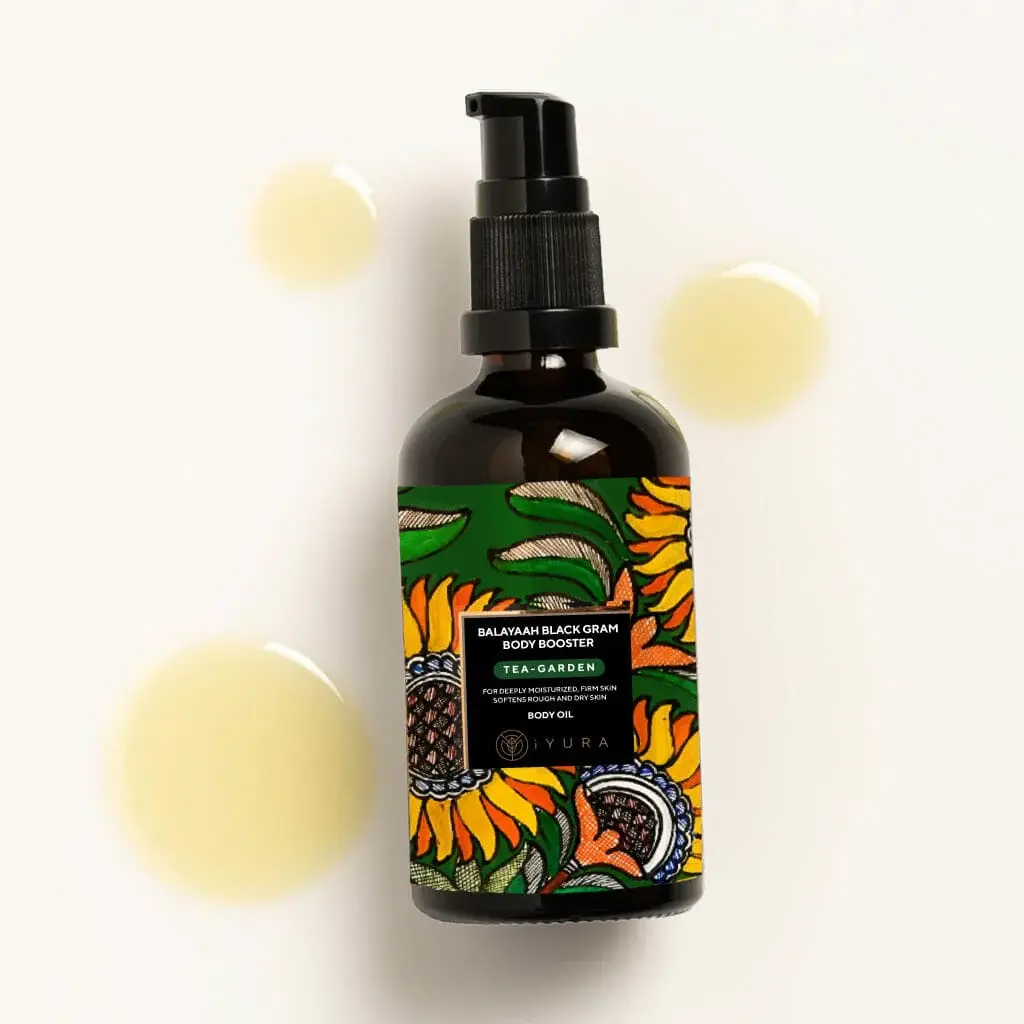 A few drops of Balaayah Black Gram Body Booster - Tea Garden Blend with it's bottle