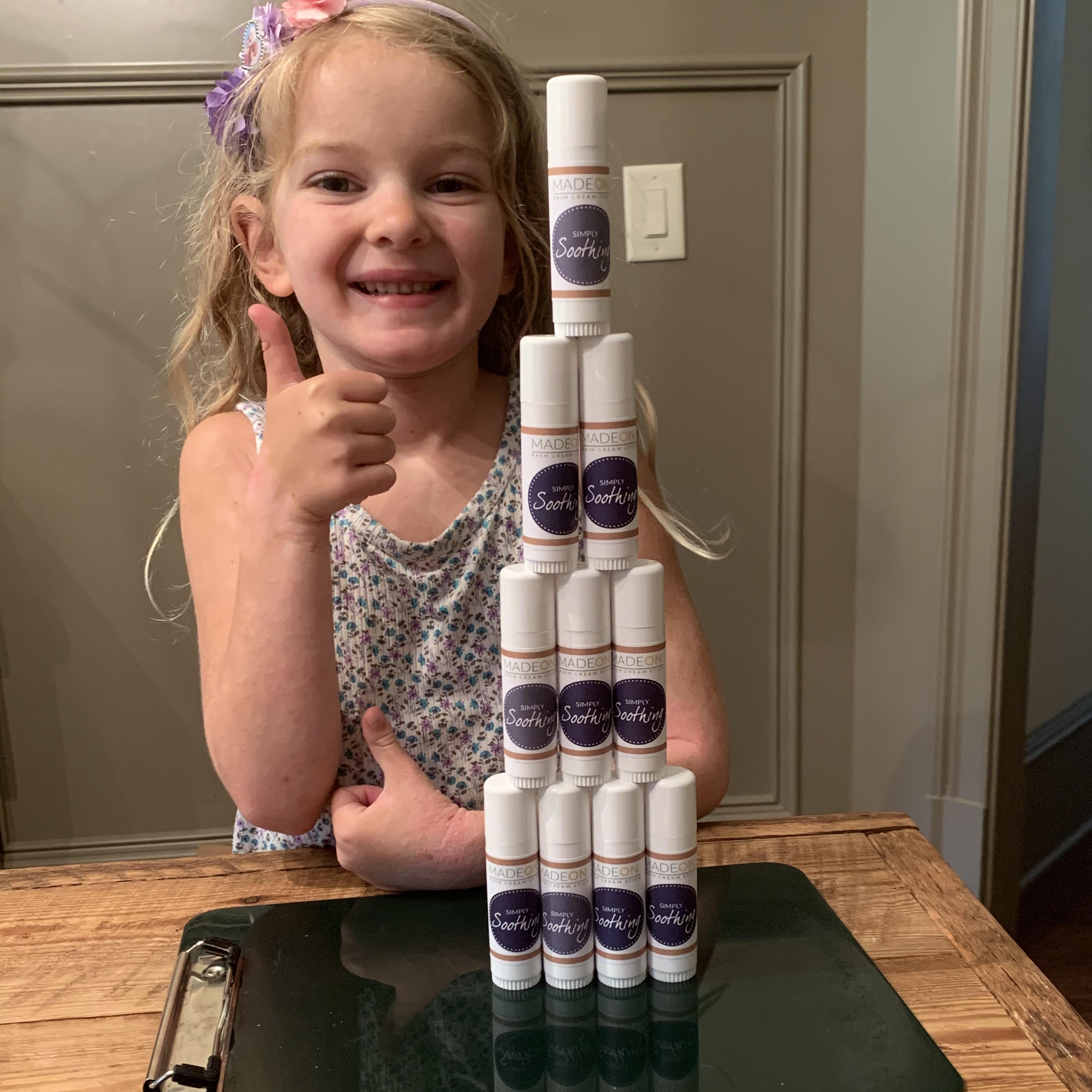 girl with several simply soothing rash sticks
