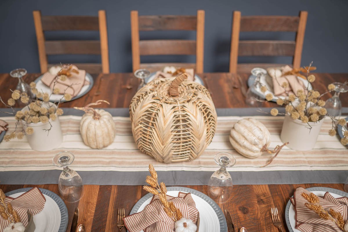 plaid table runner and rustic faux pumpkins