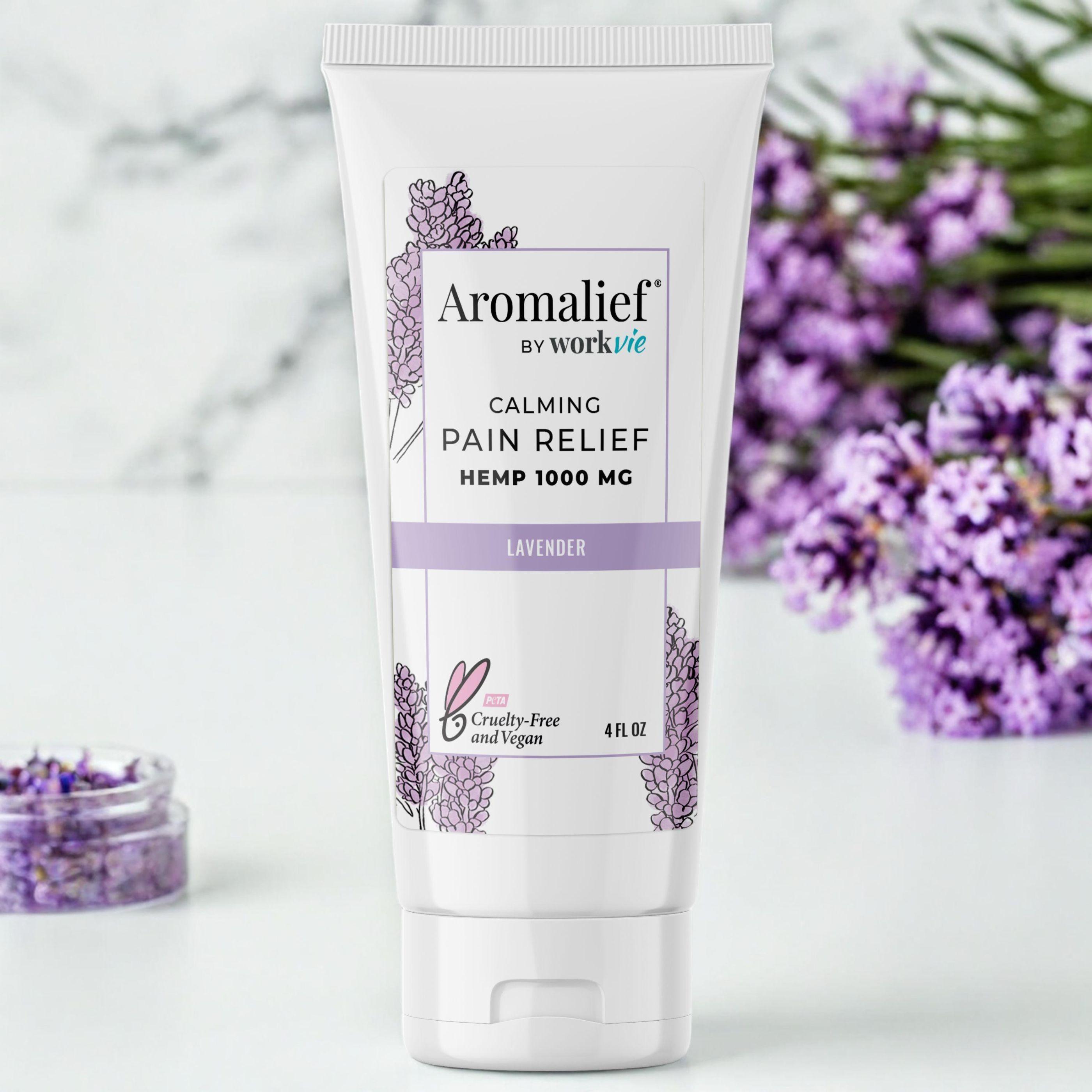 Aromalief Lavender Pain Relief Cream for Arthritis. Woman holding pain relief cream.