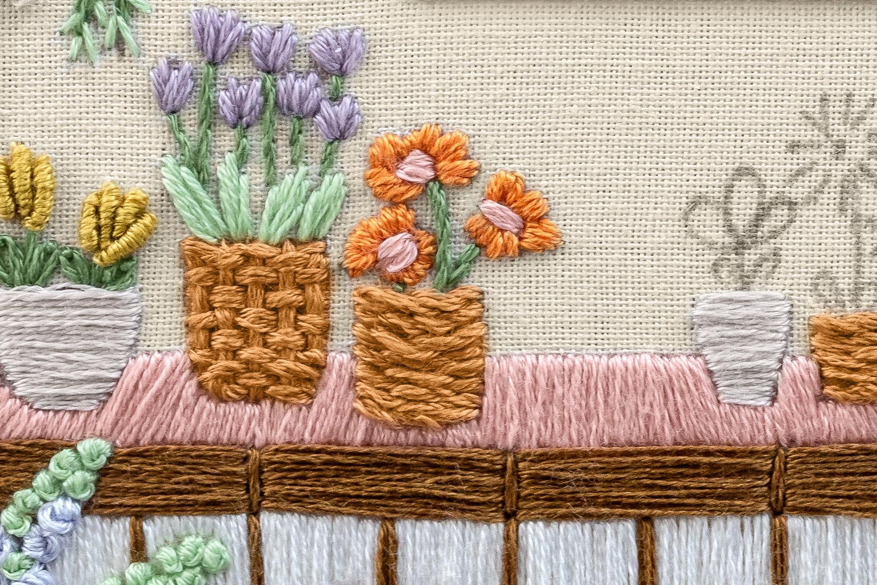 The Flower Stall embroidery pattern, with weave stitch adding texture among the florals.