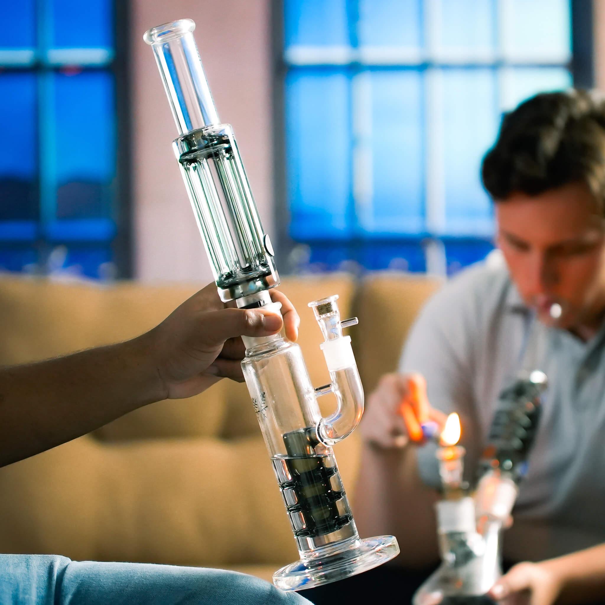 hand holding freeze pipe straight tube bong pro