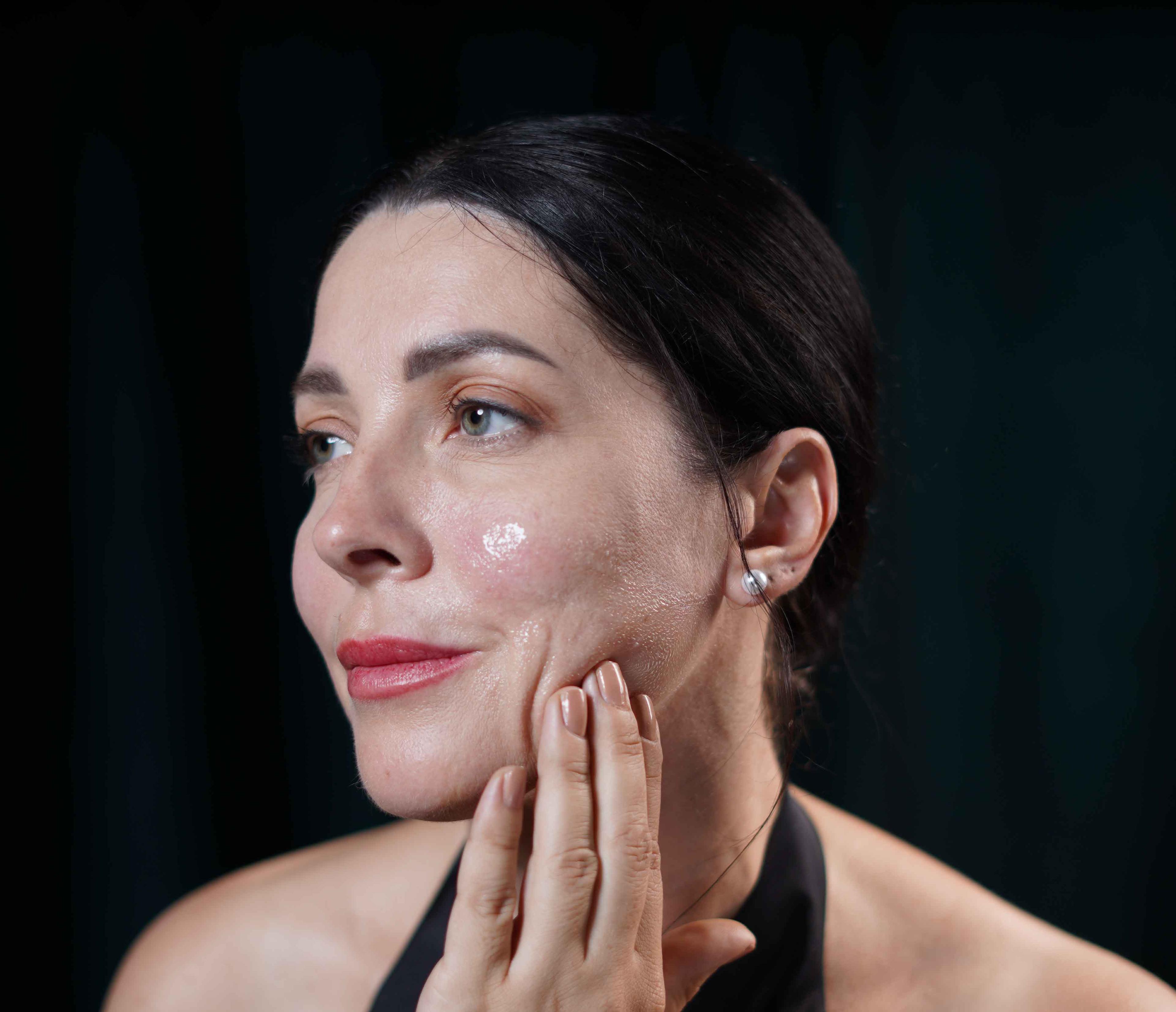 Women applying Face Serum