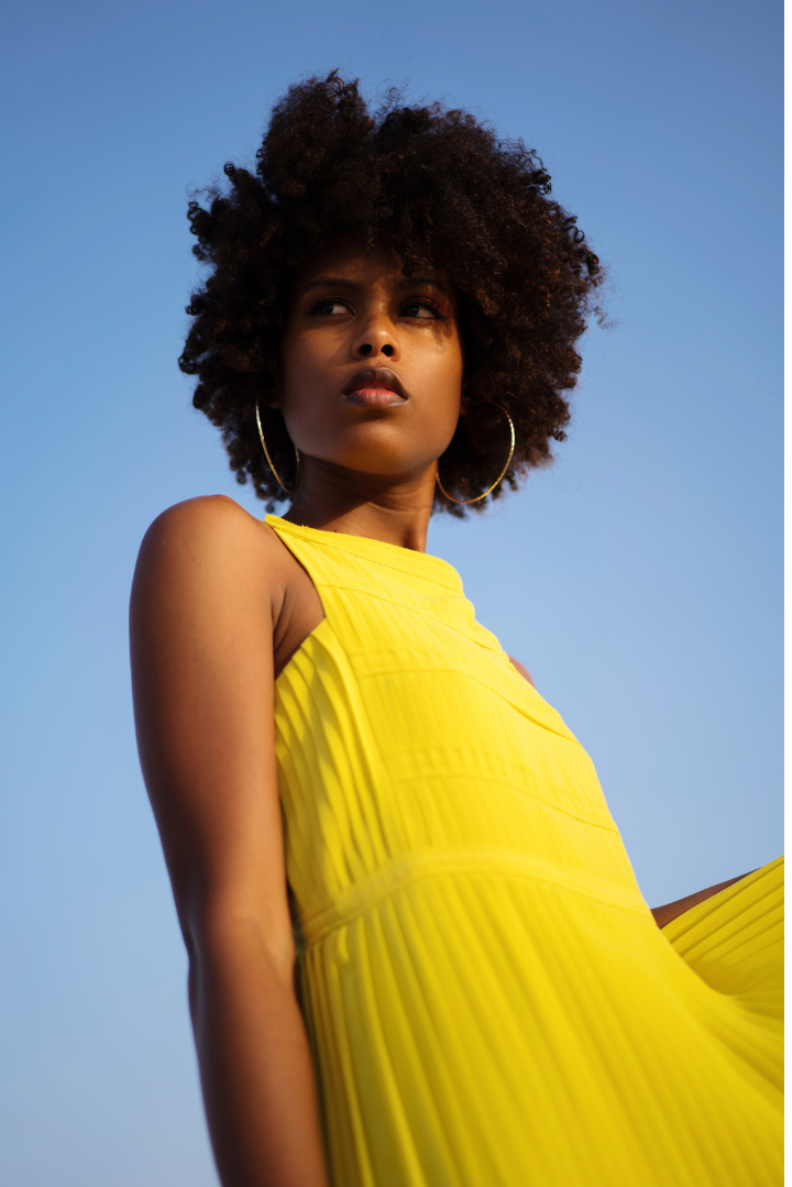 Black woman in yellow dress