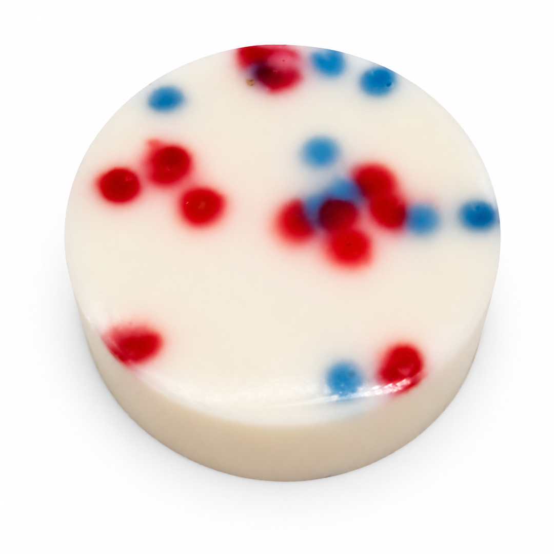 Dirty dangles screamin eagle 4th of july stick wax on a white background showing red and blue dots in the wax