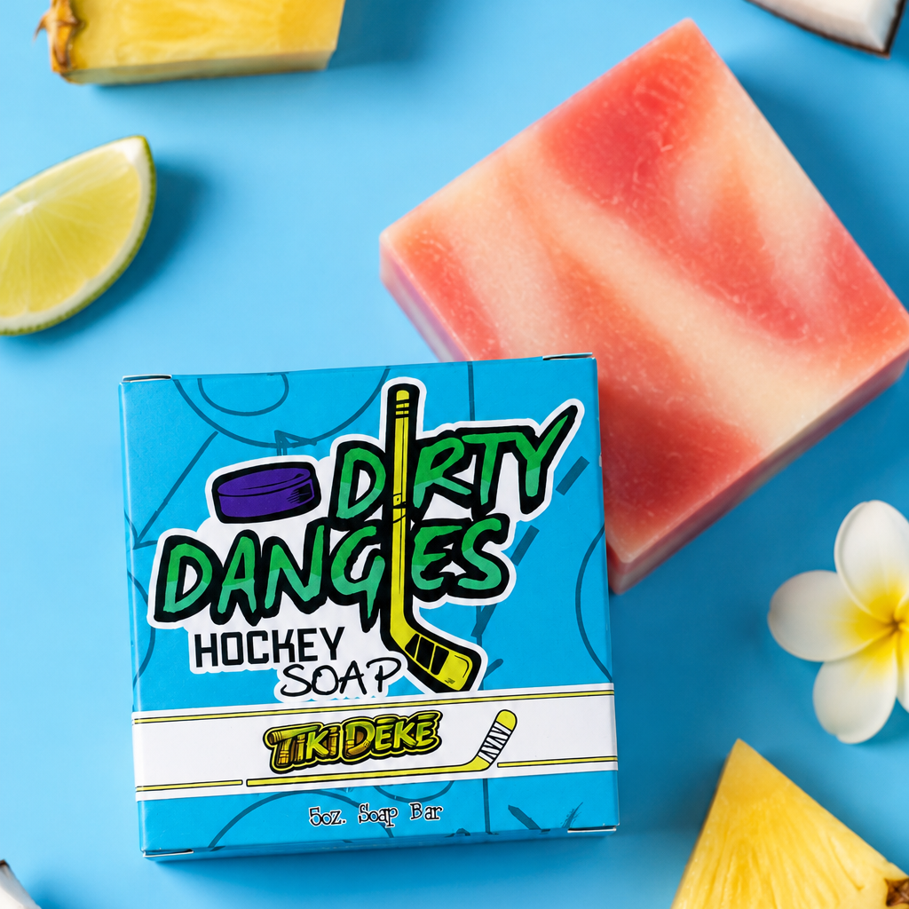 a bar of tiki deke tropical coconut girls hockey soap on a blue background with coconut, pineapple, limes and flowers