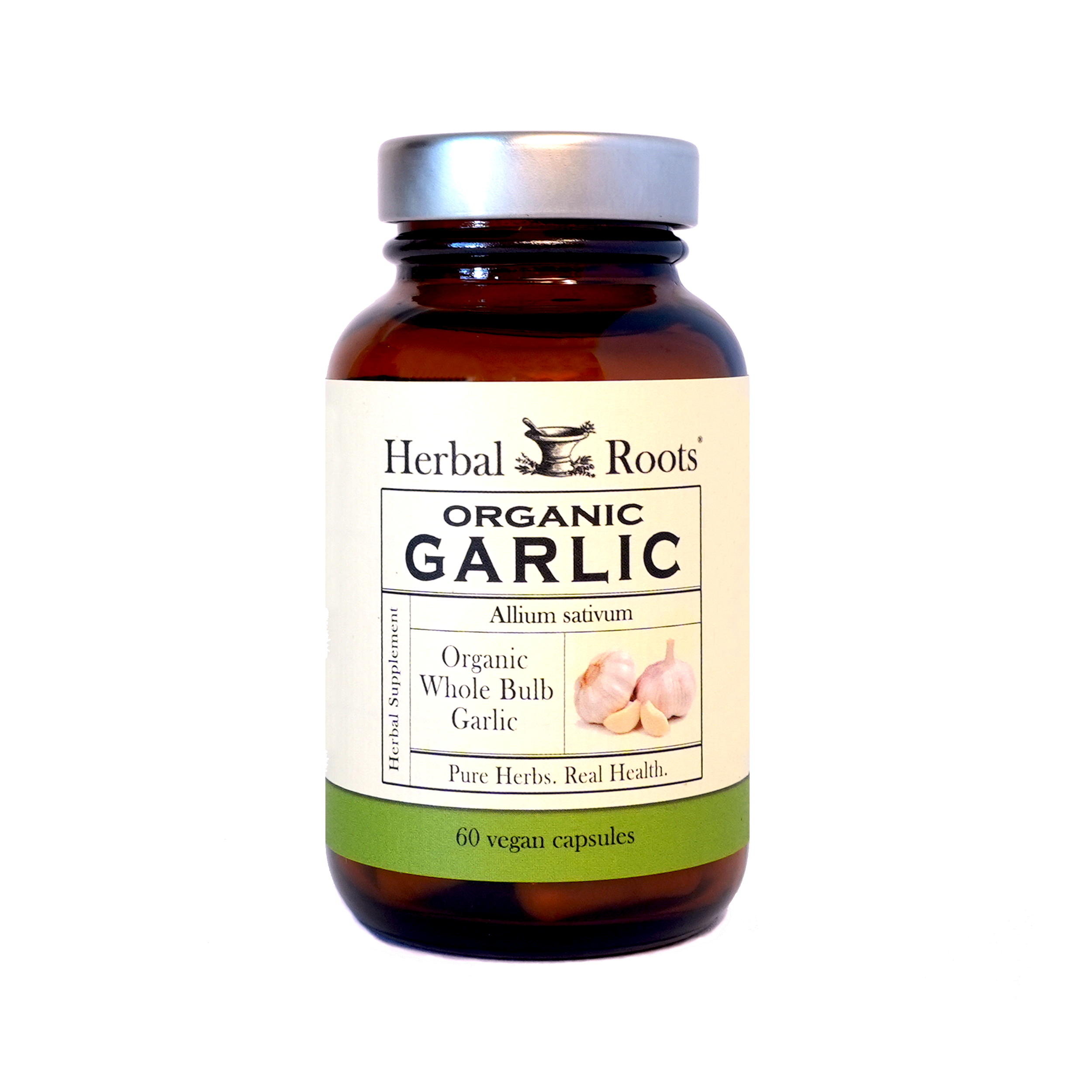 Amber Bottle and silver lid with matching white and green label. Black and white Herbal Roots logo with illustration of a mortar and pestle with herbs on top and sides. The text says, "Organic garlic.” The fronts of the labels say, "Allium Sativum, organic whole bulb garlic. Pure Herbs. Real Health. Herbal Supplement and 60 Vegan Capsules.." The label has a small image of two white, garlic bulbs and two pale garlic cloves. Next to the bottle, are four white garlic cloves and white supplement capsules.