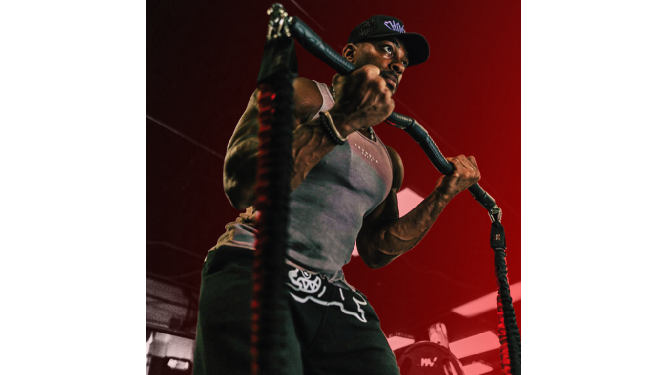 Man doing bicep curls with resistance bands