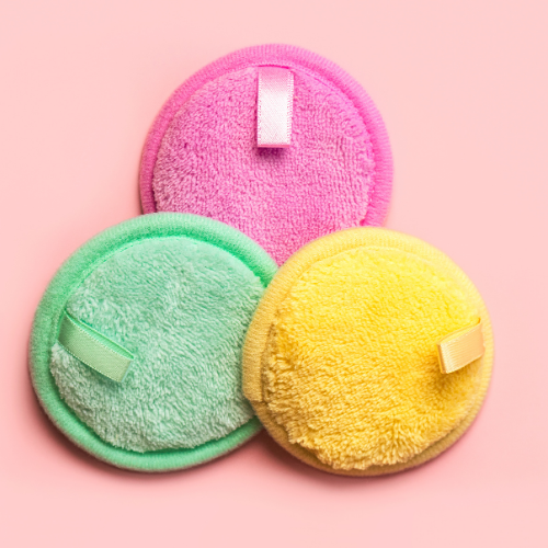 3 brightly colored round reusable makeup removers.