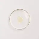 A drop of Balaayah Black Gram Body Booster - Tea Garden Blend in a petri dish