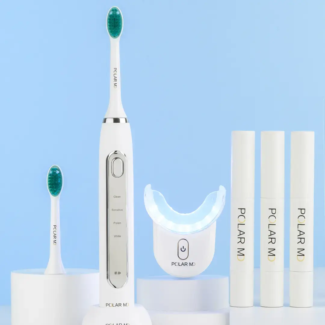 photo of polar MD toothbrush and polar md teeth whitening ket with mouthpiece and 3 gel whitening tubes.