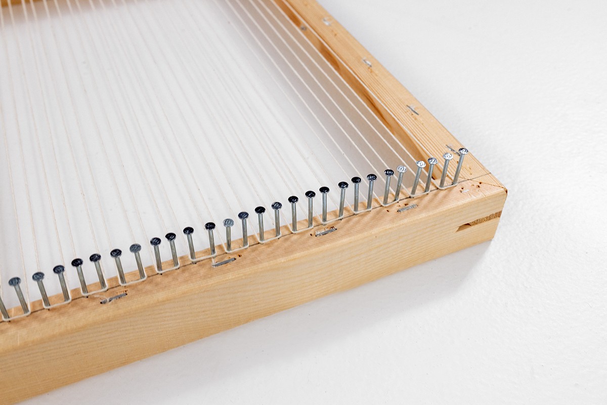 This image is of a warped DIY frame loom.
