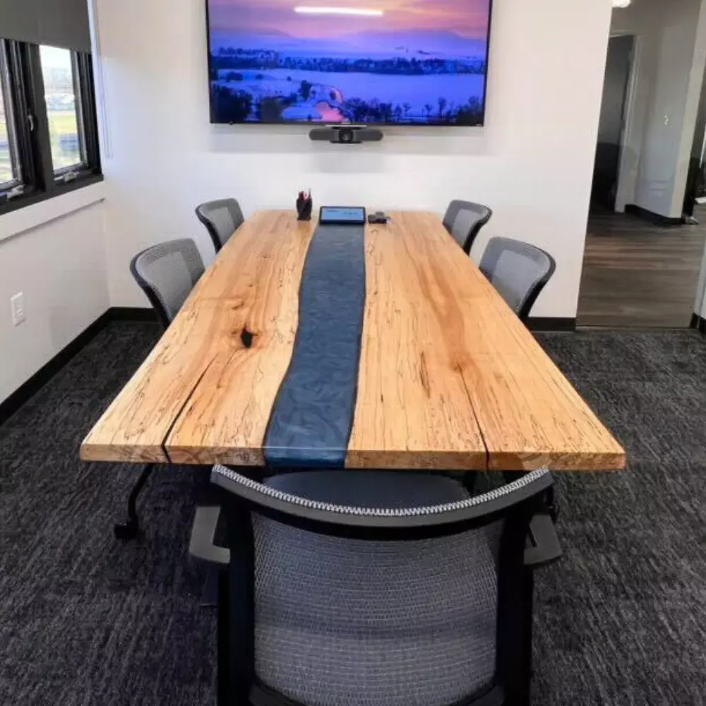 solid wood conference table with blue epoxy and industrial steel legs for modern offices