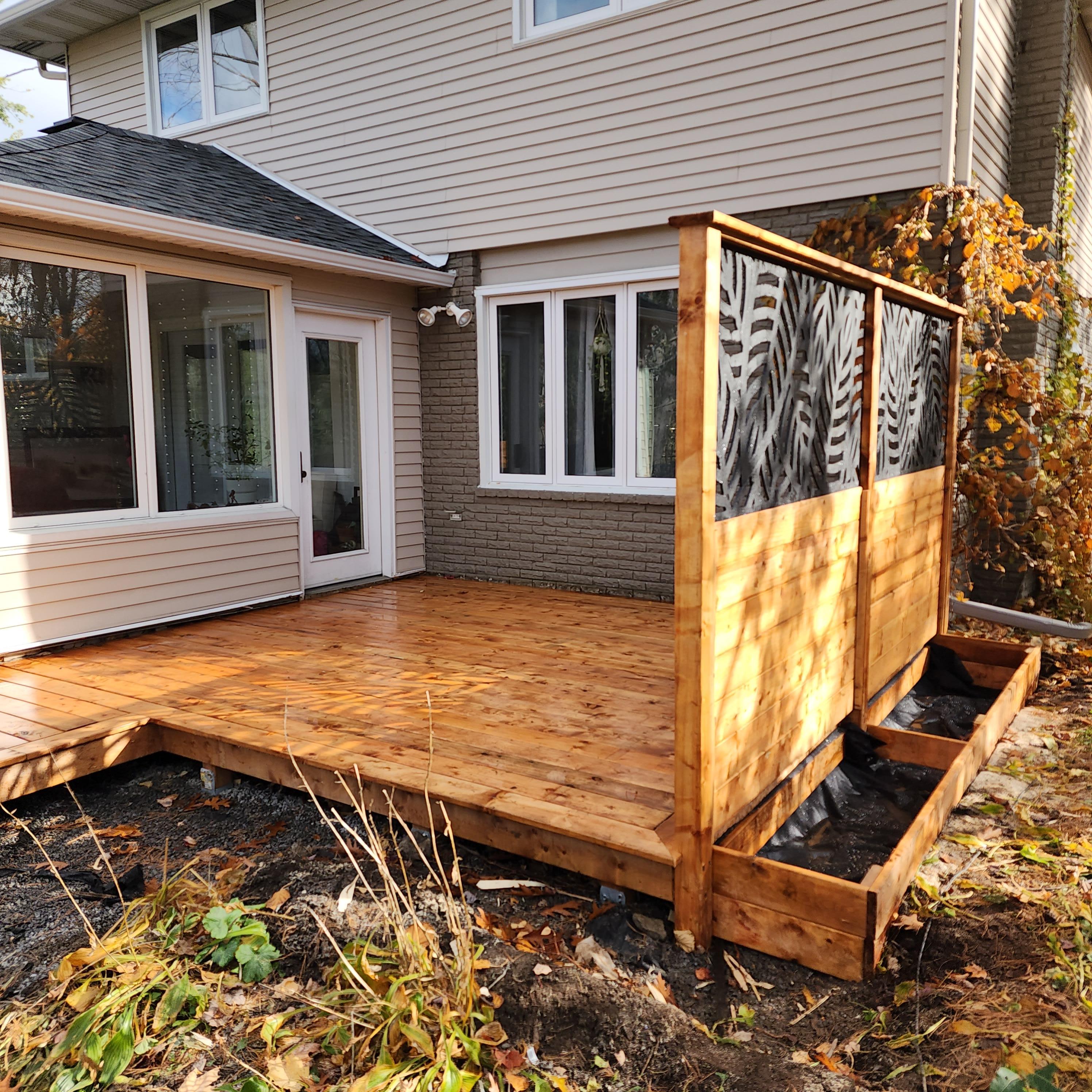 Close up of another side of the deck showing privacy wall and planter boxes in greater detail